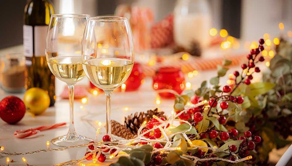 Holiday decor with white wine glasses